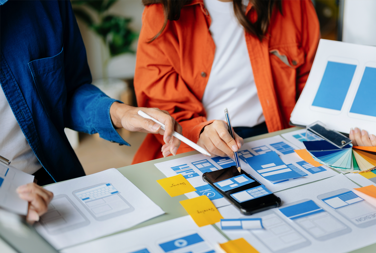 Upclose image of a group of women working on papers and documents